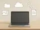 Symbolbild: Laptop mit Symbolen darum.